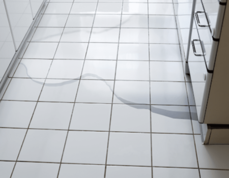 Kitchen floor with water leaks.