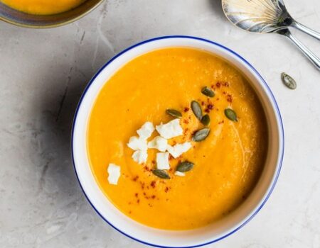 soup in a bowl with seeds on top