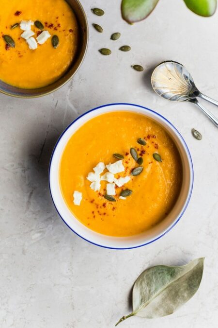 soup in a bowl with seeds on top