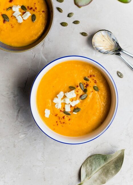 soup in a bowl with seeds on top