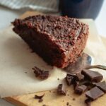 Vegan Chocolate cake with chocolate and on a chopping board