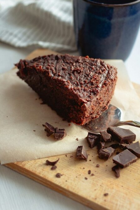 Vegan Chocolate cake with chocolate and on a chopping board