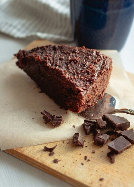 Vegan Chocolate cake with chocolate and on a chopping board