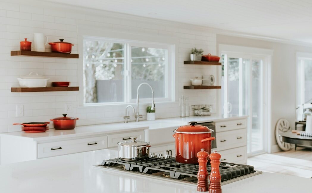 Kitchen with Crockery Pots and white furnishings