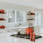 Kitchen with Crockery Pots and white furnishings