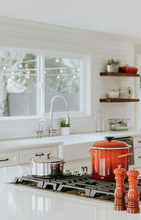 Kitchen with Crockery Pots and white furnishings